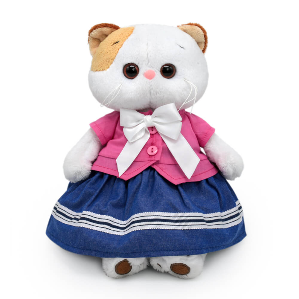 в жакете с бантом и юбке