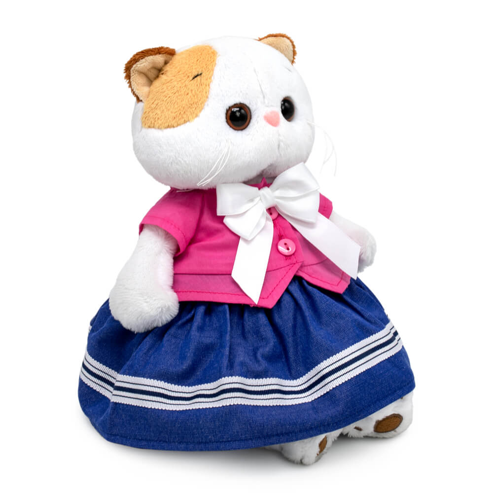 в жакете с бантом и юбке